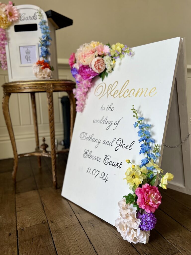 Welcome sign to a wedding at Elmore Court in Gloucestershire