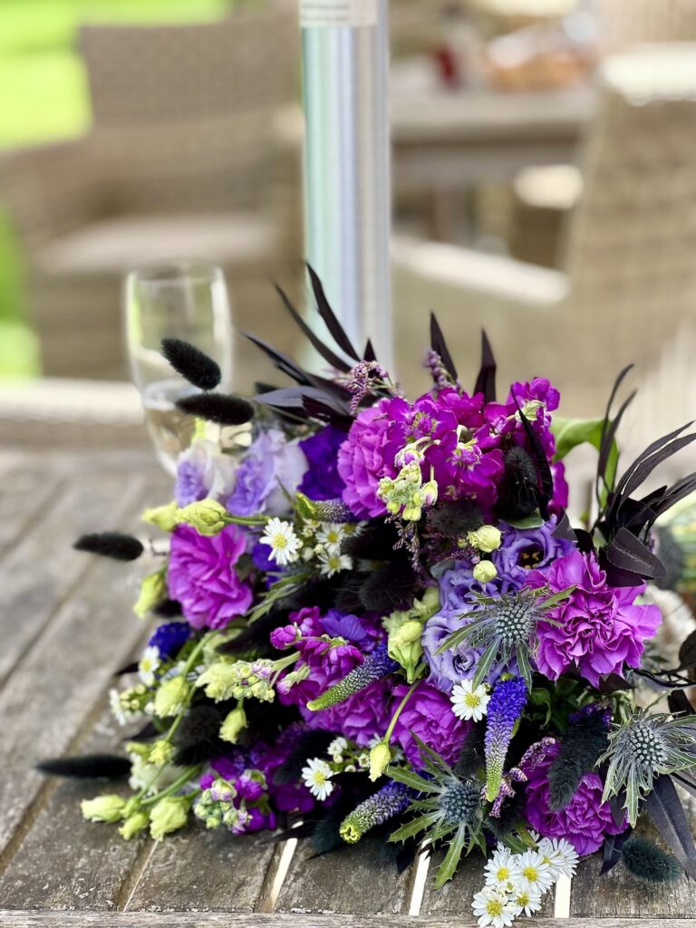 Brides wedding bouquet with purple flowers