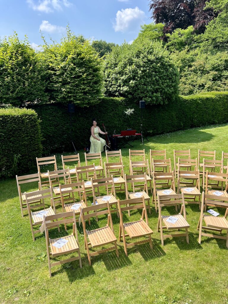 JAM Duo Wedding Ceremony Setup musicians cello and piano in the garden at Owlpen Manor