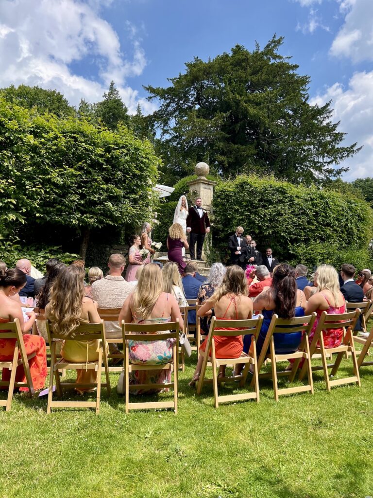 Outdoor wedding ceremony for Leeanne and Dan at Owlpen Manor
