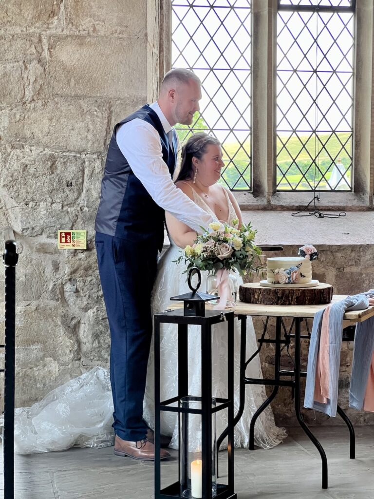 Bride and Groom Cutting Cake