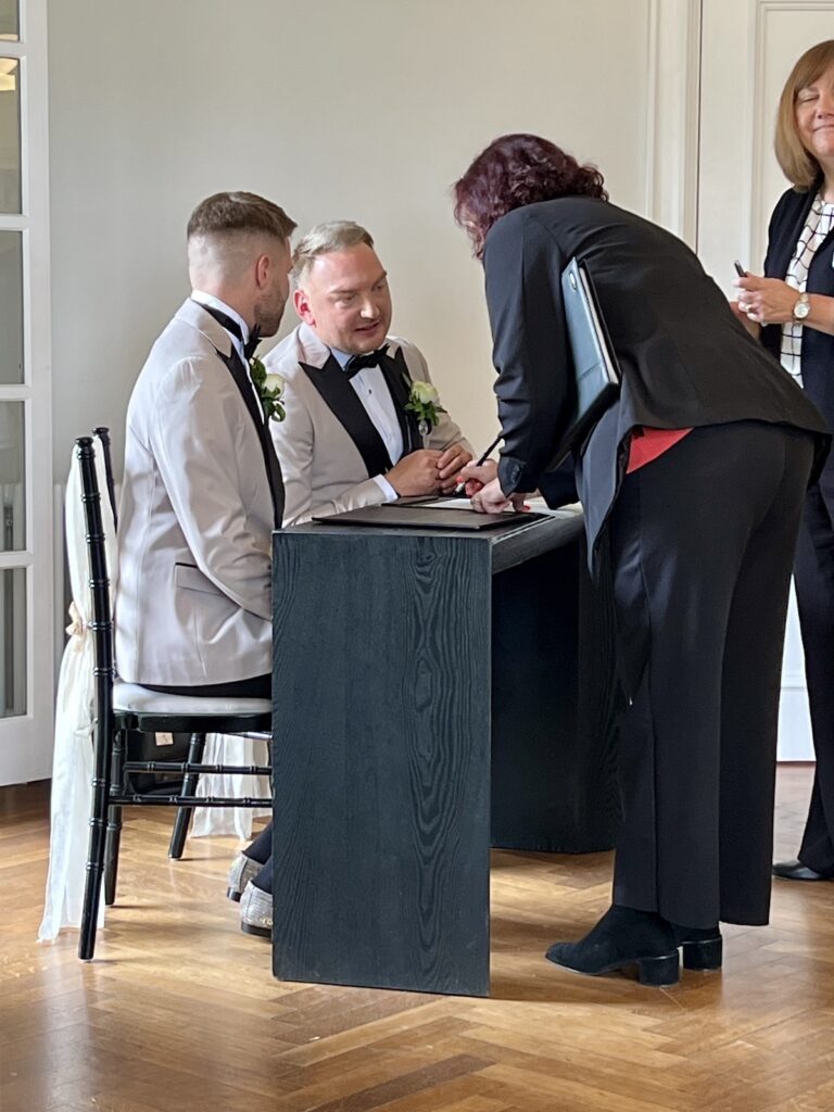 Signing the register at Sant Ffraed House