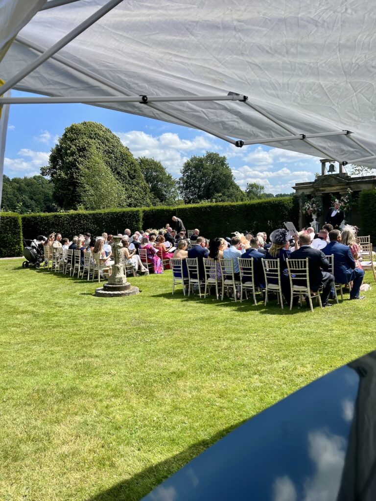 View from the piano of a wedding ceremony at Sandon hall