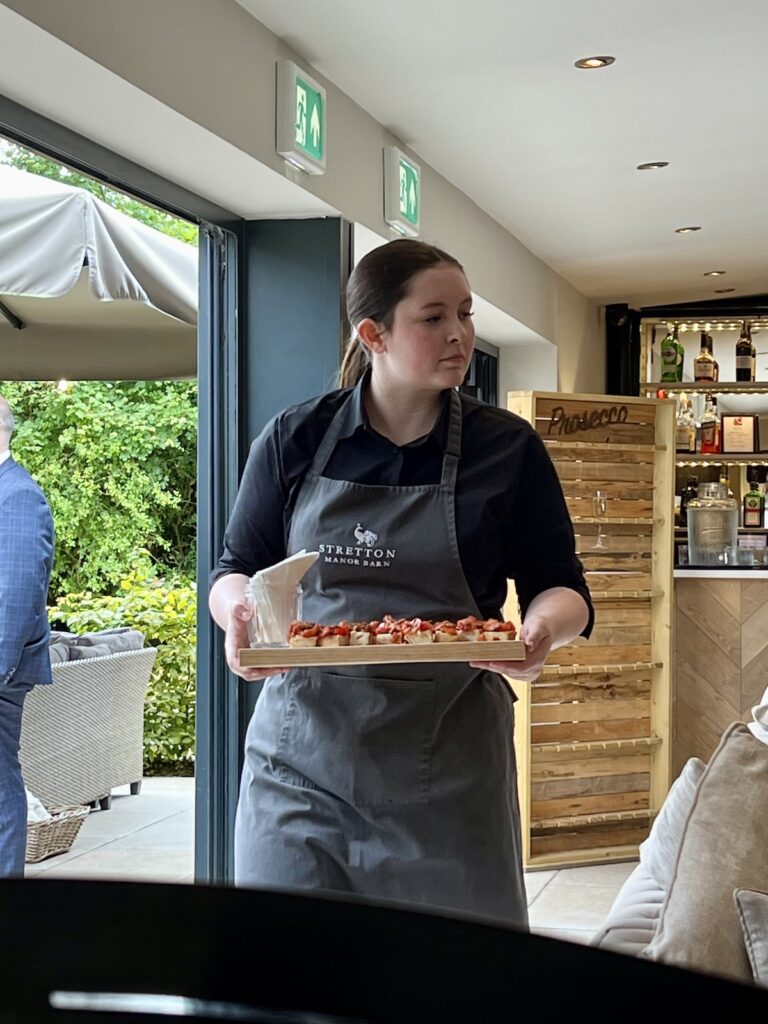 Canapes being brought out at Stretton Manor Barn