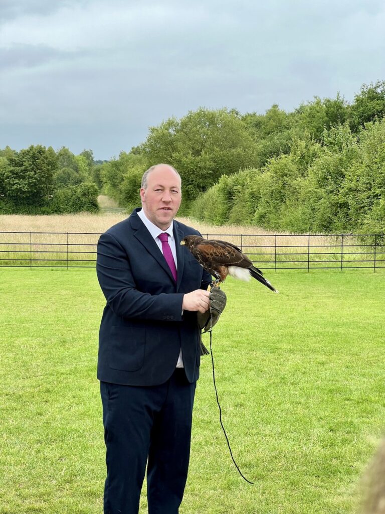 Harrier Hawk on mans arm Stretton Manor Barn