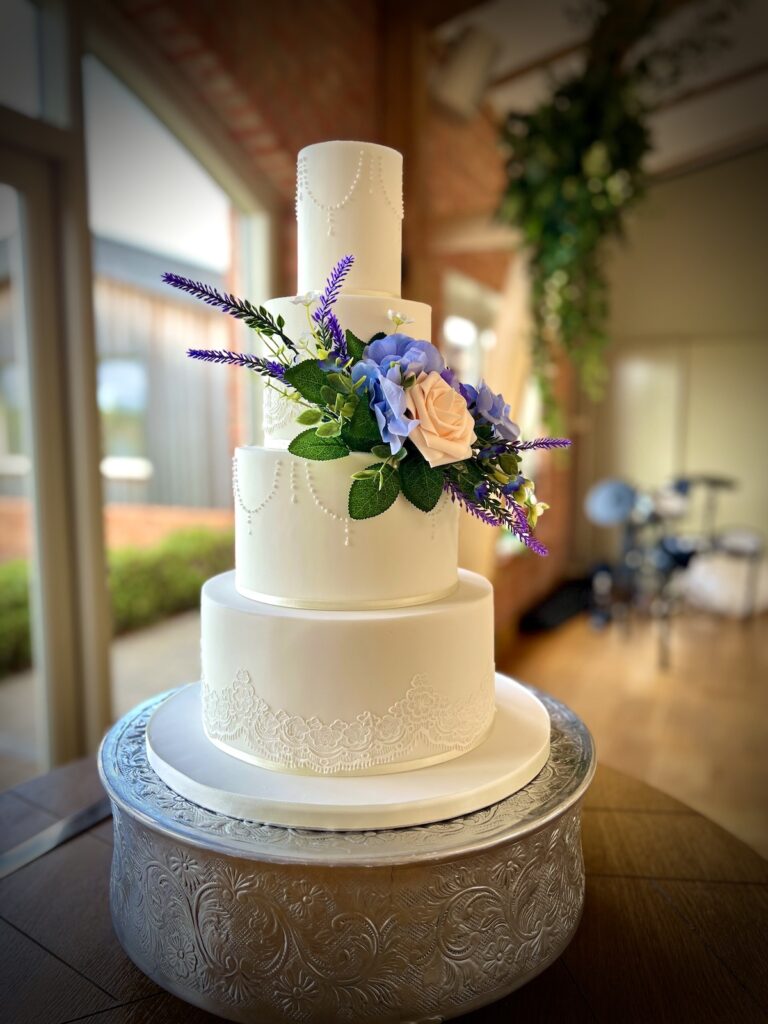 Wedding cake with roses at Cider Mill Barns