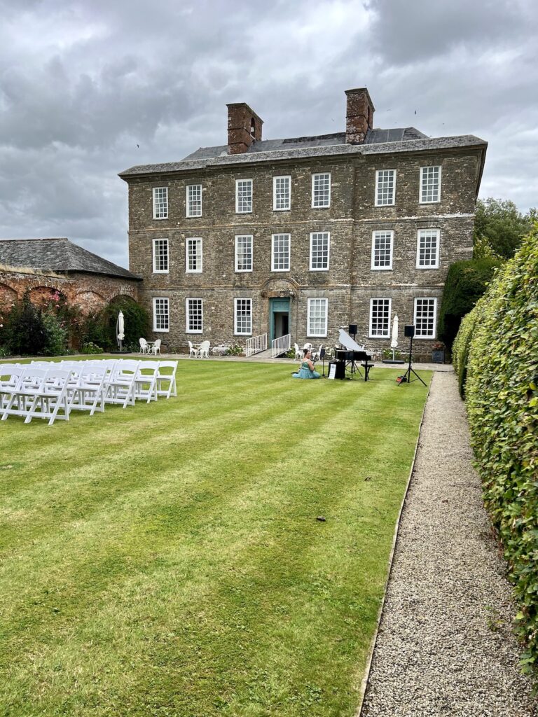 Kingston Estate set up for a ceremony with JAM Duo Cello and Piano Duo in the foreground