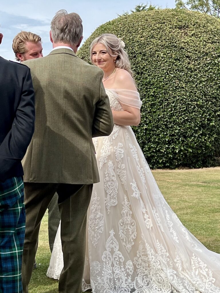 Bride and Groom at drinks reception outside