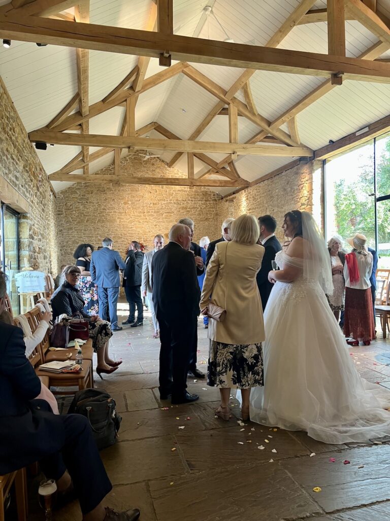 Bride in Drinks Reception at Dodford Manor Northamptonshire