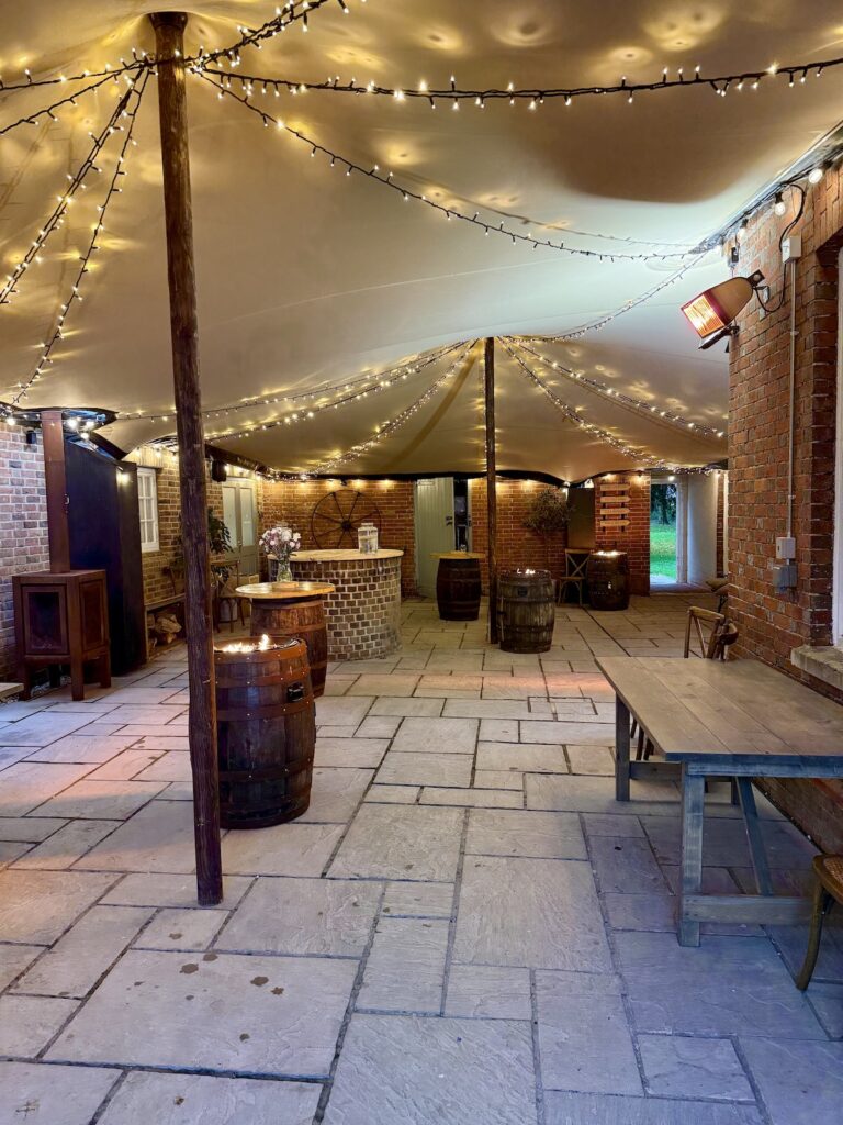 Drinks reception area with fire pits at Abbots Court, Dorset