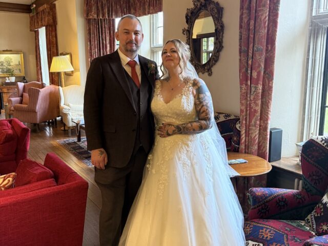 Wedding couple and bride with beautiful white dress at Llangoed Hall in Wales