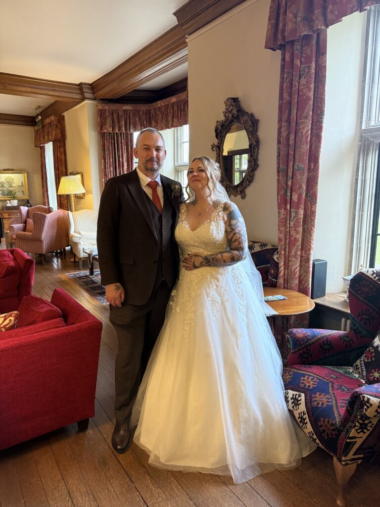 Wedding couple and bride with beautiful white dress at Llangoed Hall in Wales