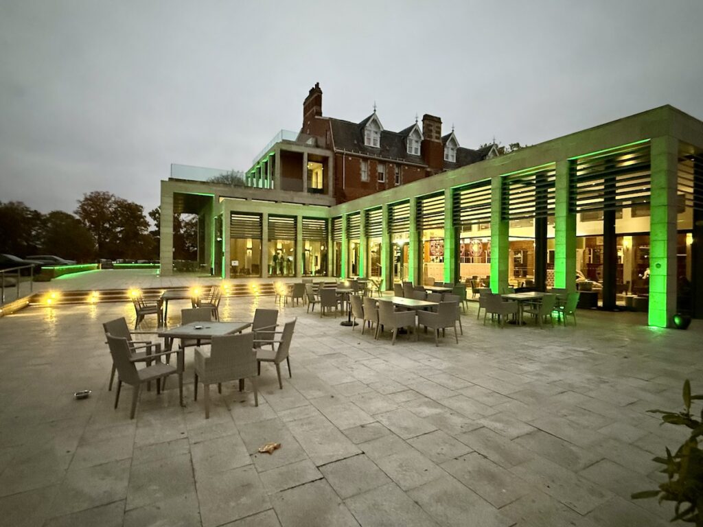 Stanbrook Abbey Hotel exterior at night with green lighting