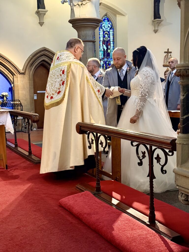 Bride and Groom at the Altar in a Catholic Church