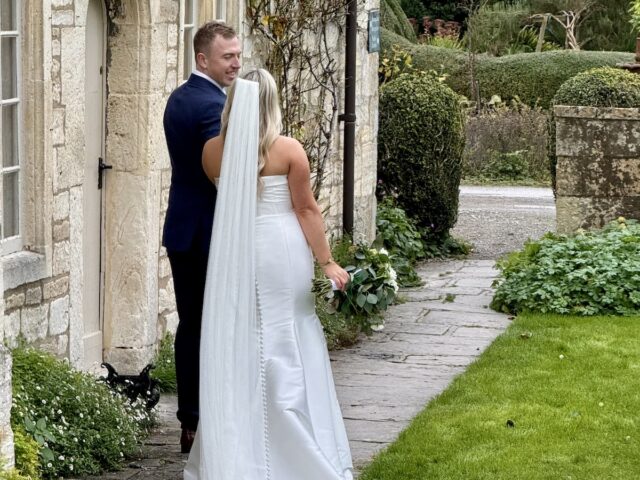 Wedding Couple in Wiltshire outside stone house