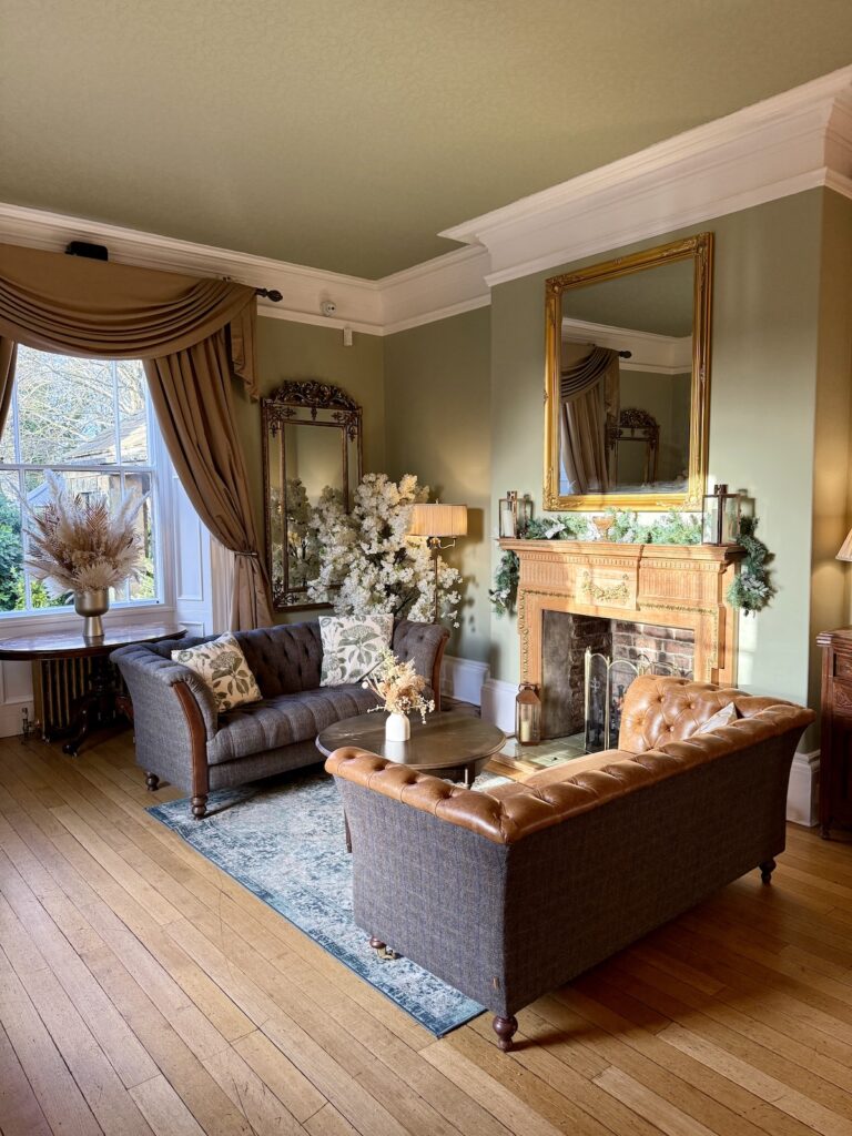 The lounge with a Christmas tree at Horton Grange Country House in Northumberland