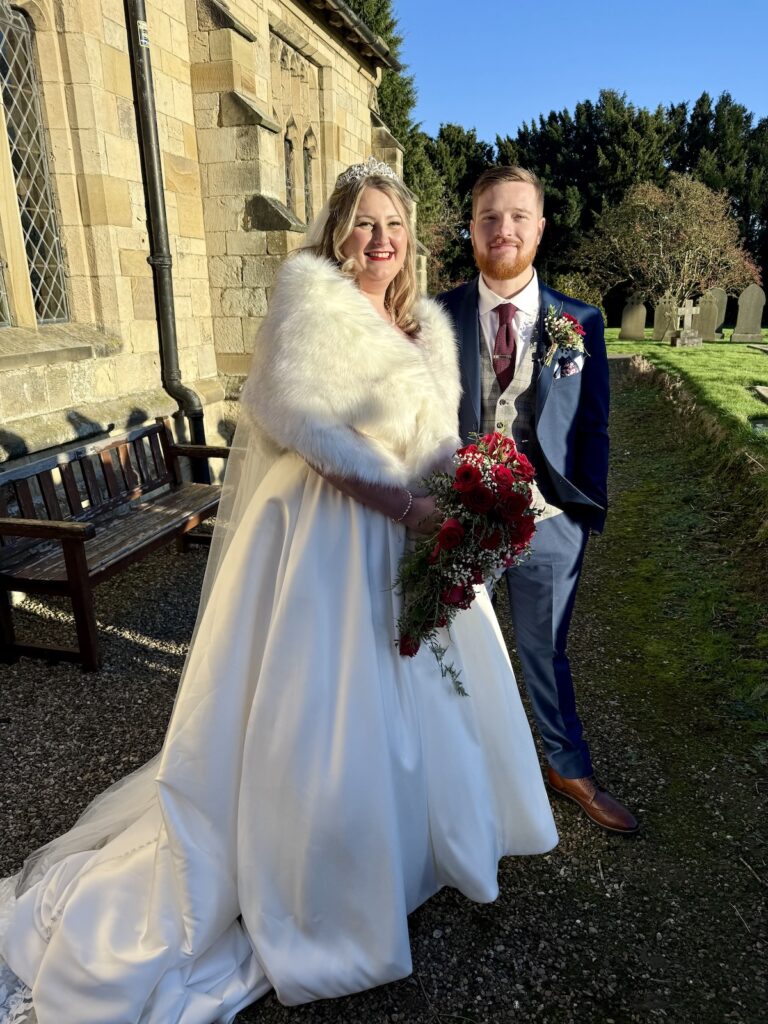 Bride and Groom Outside St Peters Church Hutton in Yorkshire